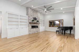 Gathering room with new built ins and fireplace.