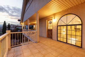 Deck space outside kitchen entry door.
