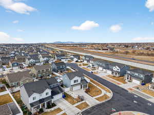 Aerial perspective of suburban area with a mountain backdrop
