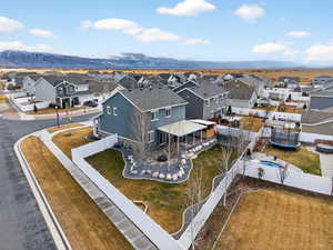 Aerial perspective of suburban area featuring a mountainous background