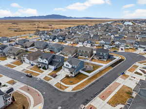 Aerial view of residential area featuring a mountainous background