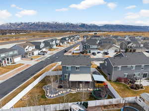 Aerial perspective of suburban area with a mountain backdrop