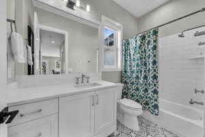 Full bathroom featuring shower / tub combo and vanity