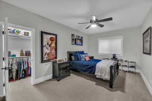 Bedroom with carpet and a ceiling fan
