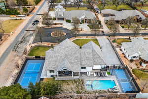 Aerial perspective of suburban area featuring a pool area