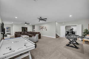 Rec room featuring recessed lighting, ceiling fan, and light colored carpet