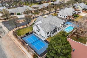 Aerial perspective of suburban area featuring a pool area