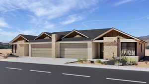 View of front of home with stone siding, a garage, concrete driveway, and a mountain view