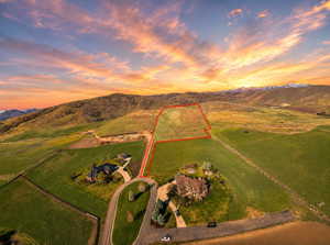 Expansive undeveloped parcel outlined in red, featuring a gently sloped terrain