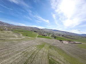 View of mountain backdrop with rural landscape