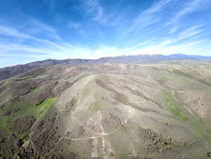 View of mountain backdrop featuring rural landscape