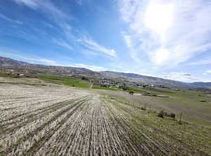 View of mountain backdrop with rural landscape