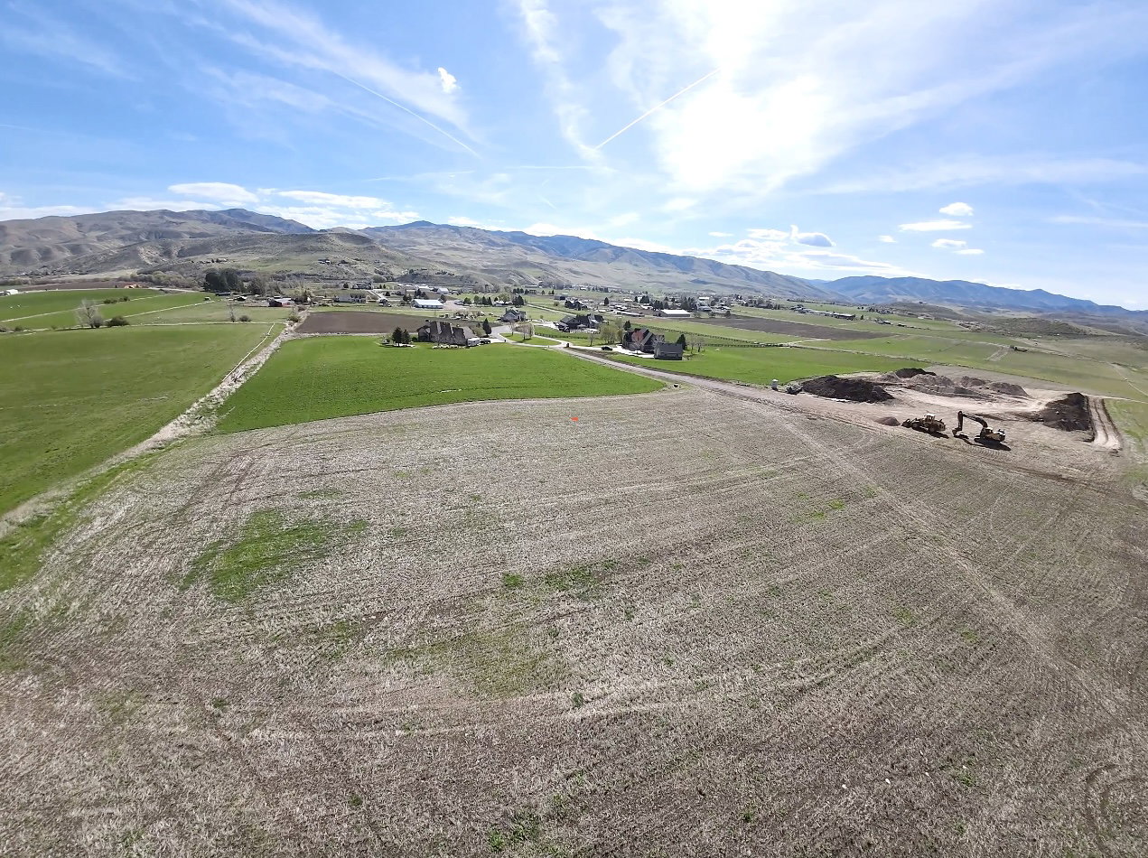 View of mountain background featuring rural landscape and large plots for crops