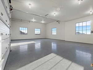 Half of the garage with baseboards