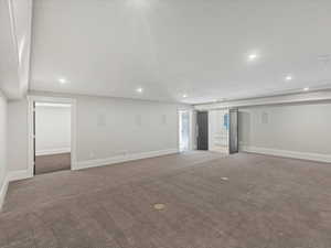 Theatre room featuring carpet floors, recessed lighting, and surround sound