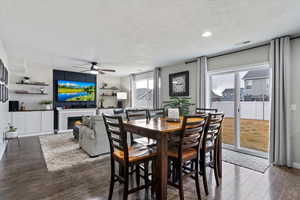 Dining area within a spacious open layout featuring LVP flooring and easy access to the backyard for indoor-outdoor entertaining.