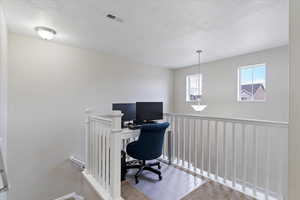 Upper-level loft / flex space offering a functional area for work or study.