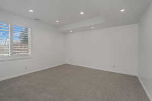 Unfurnished room featuring carpet and recessed lighting