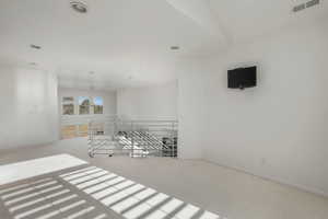 Empty room featuring carpet floors and recessed lighting