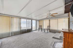 Sunroom / solarium with a ceiling fan