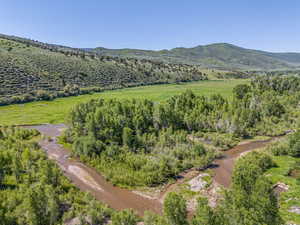 Overview of rural landscape featuring a mountainous background