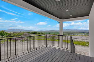 Wooden terrace featuring a mountain view