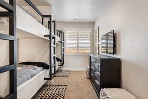 Bedroom featuring light colored carpet and recessed lighting