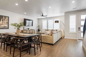 Dining room with light wood-type flooring, ceiling fan, and recessed lighting