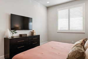 Bedroom featuring recessed lighting and baseboards