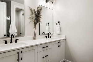 Full bath featuring double vanity