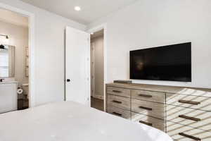 Bedroom featuring recessed lighting and ensuite bathroom