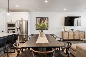 Dining area featuring recessed lighting