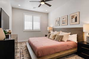 Bedroom with ceiling fan and recessed lighting