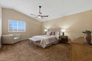 Bedroom with lofted ceiling, carpet floors, and ceiling fan