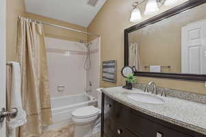 Full bath with vanity and shower / bath combination with curtain