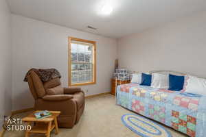 Bedroom with carpet and baseboards