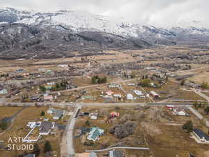 View of property location featuring a mountain backdrop and nearby suburban area