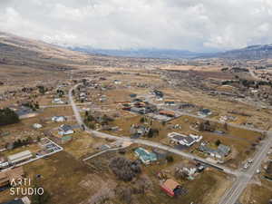 Aerial perspective of suburban area featuring a mountainous background
