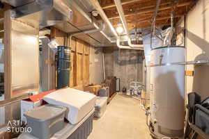 Unfinished below grade area featuring secured water heater and a central vacuum unit