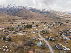 Aerial perspective of suburban area with a mountainous background