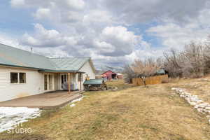View of yard with a deck and french doors