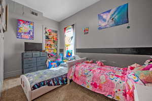 Bedroom featuring carpet