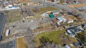 Aerial view of property's location with nearby suburban area