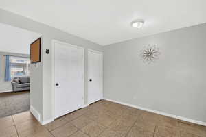 Kitchen with tile floor, pantry and closet