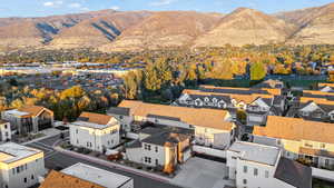Aerial view of residential area featuring a mountainous background
