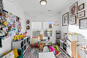 Office on main floor purposed as a playroom currently