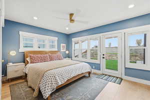 Bedroom featuring light wood-style floors, access to outside, a ceiling fan, and recessed lighting