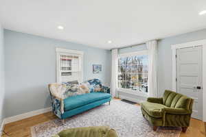 Sitting room featuring wood finished floors and recessed lighting