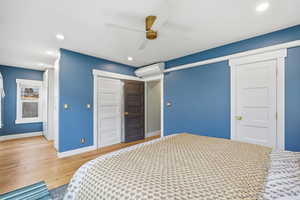 Bedroom with a closet, recessed lighting, wood finished floors, and ceiling fan