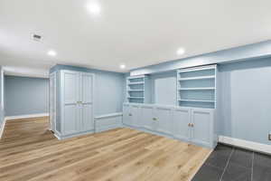 Basement featuring light wood-style floors and recessed lighting